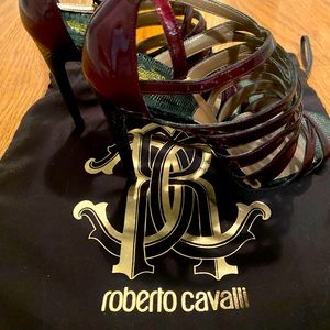 Mahogany strap heels in patent leather. Unworn and in pristine condition.